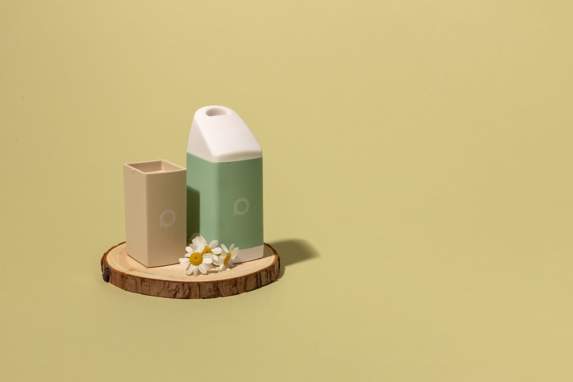 Sage PHREND personal smoke filter and replacement cartridge on a wood slice